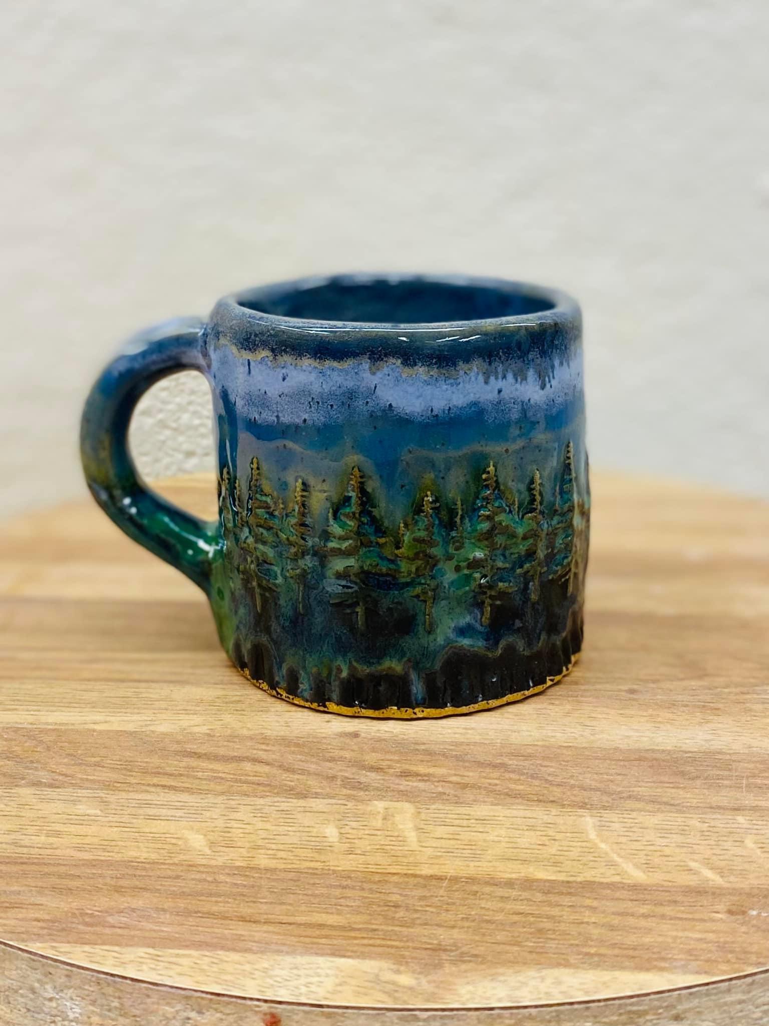 Sky and Storm over the trees mug by Beth Ellen Roberts