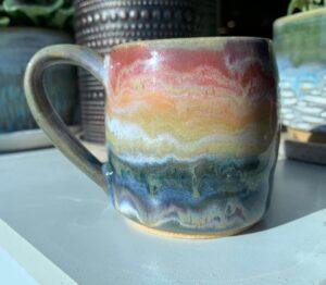 Drippy rainbow mug by Joanne Vukman