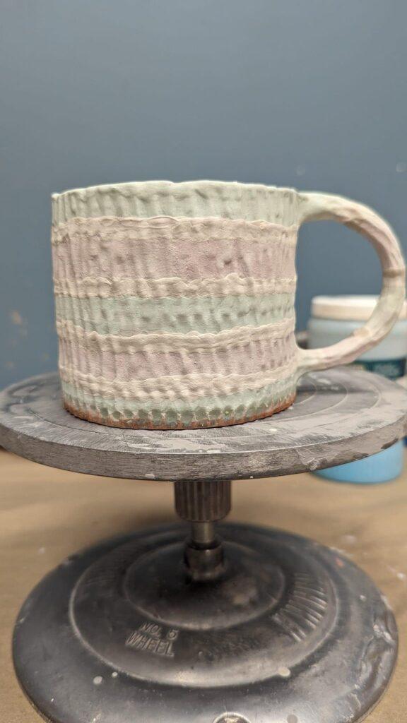 Blue-green carved mug by Ally Brogan prefire