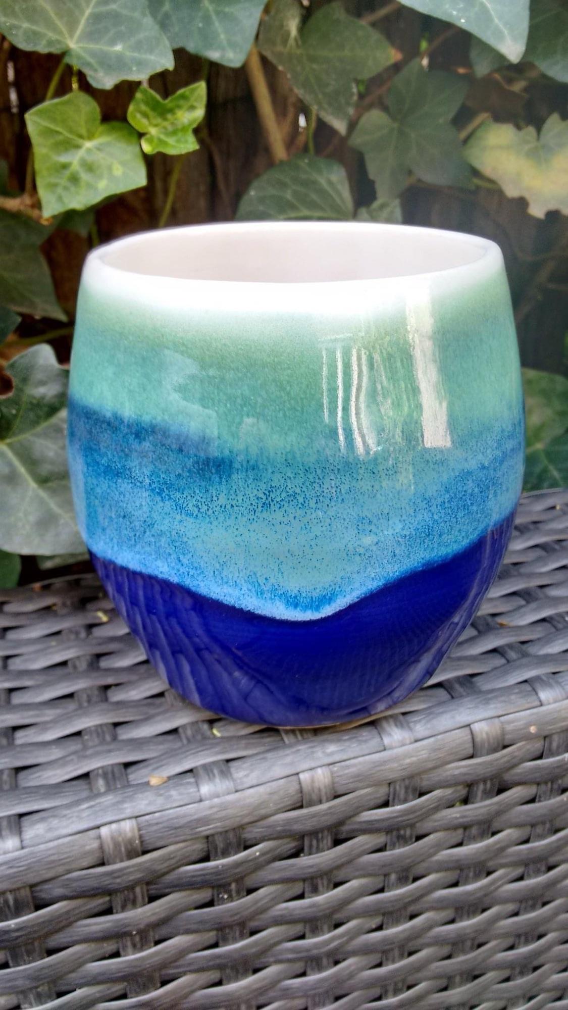 AMACO Snow, Cobalt and Seaweed on the stoneware tumbler