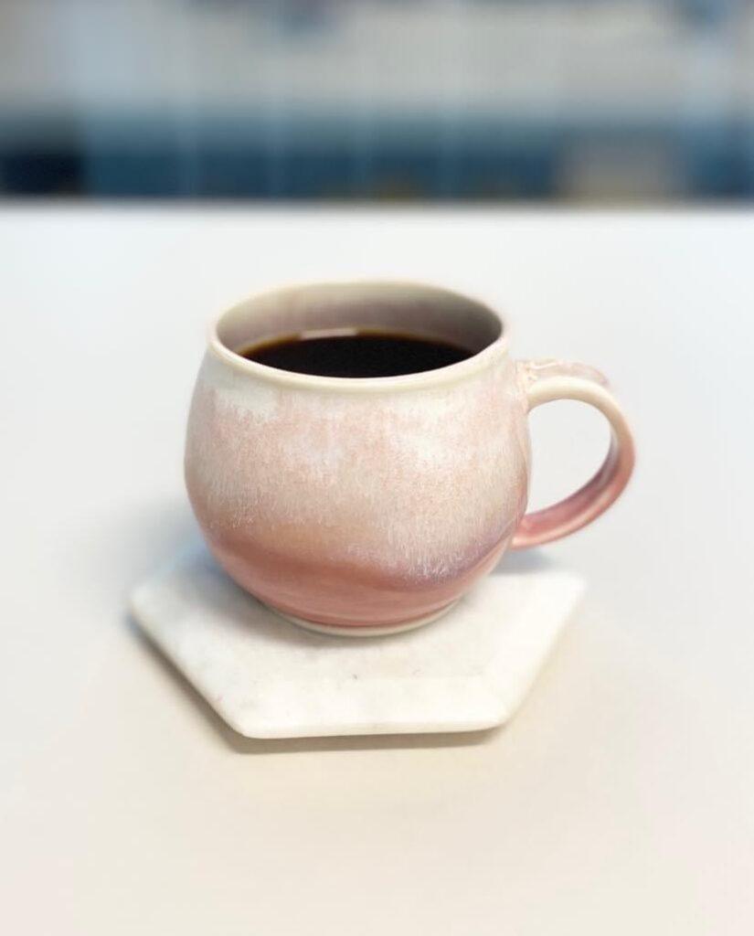 Round pinkish porcelain mug by Jennifer Li Merchant